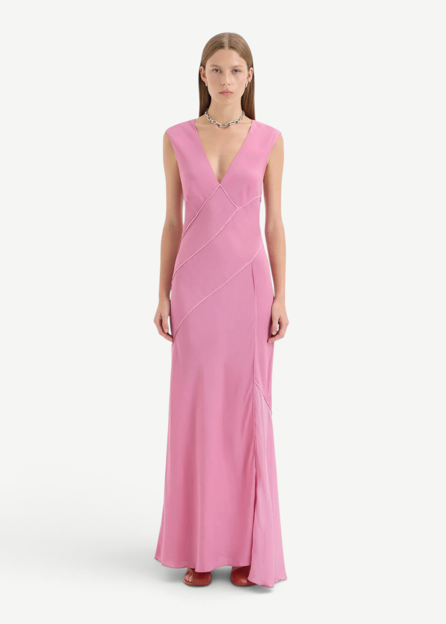 KABE SHOP INC Elin pink silk-viscose maxi gown with deep V-neck, panelled detailing, and asymmetric hem on a model.