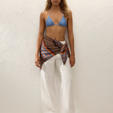 KABE SHOP INC Soleil waist scarf in striped satin worn over white linen trousers and a blue bikini top