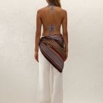 KABE SHOP INC Soleil waist scarf in striped satin worn over white trousers by a model against a textured wall