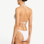 Model wearing KABE SHOP INC white lace tie-side bikini bottoms with low-rise fit and beaded side ties, back view
