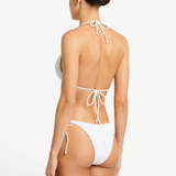 Model wearing KABE SHOP INC white lace tie-side bikini bottoms with low-rise fit and beaded side ties, back view