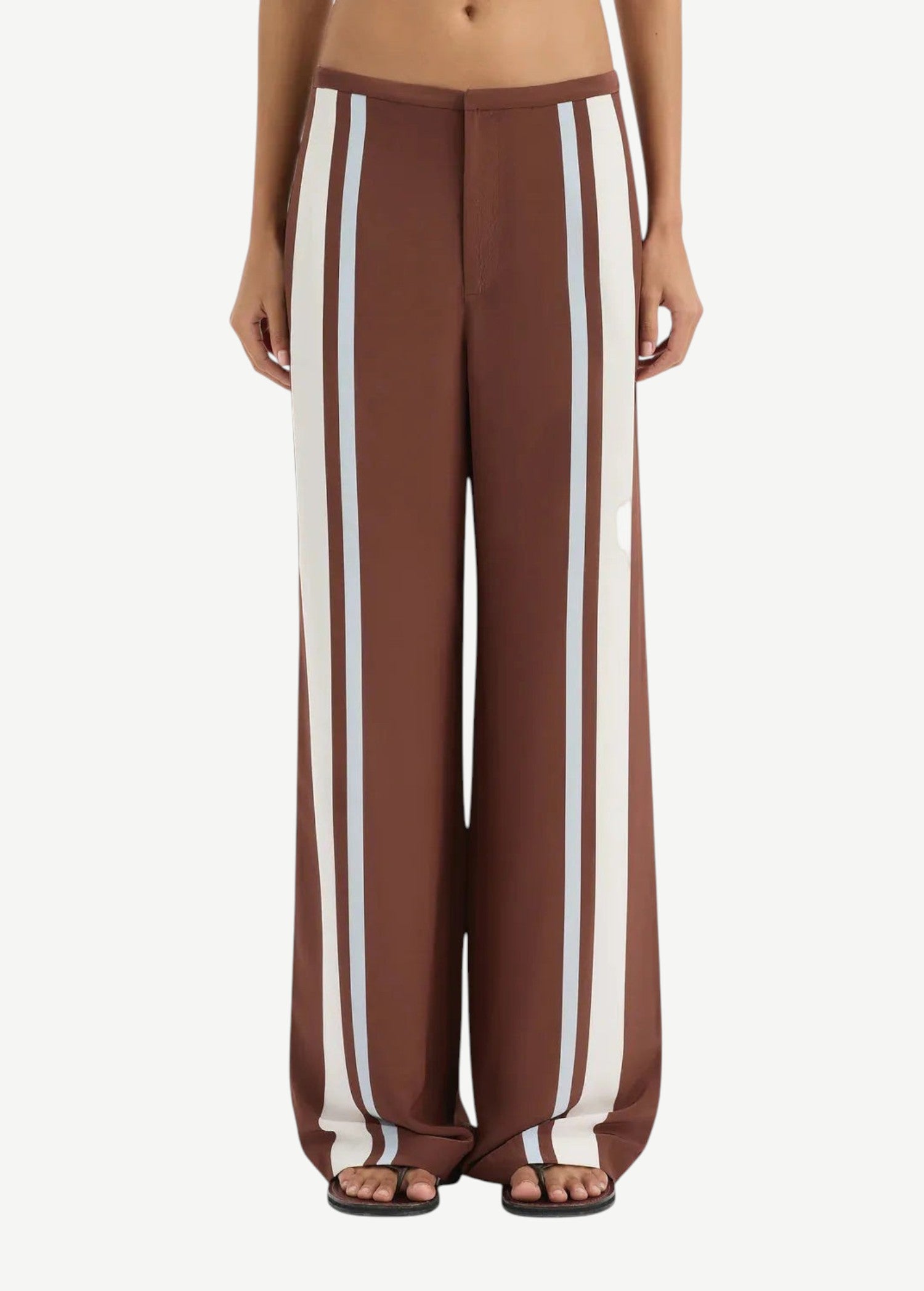 Brown wide-leg pants with white stripes worn by a person on a white background