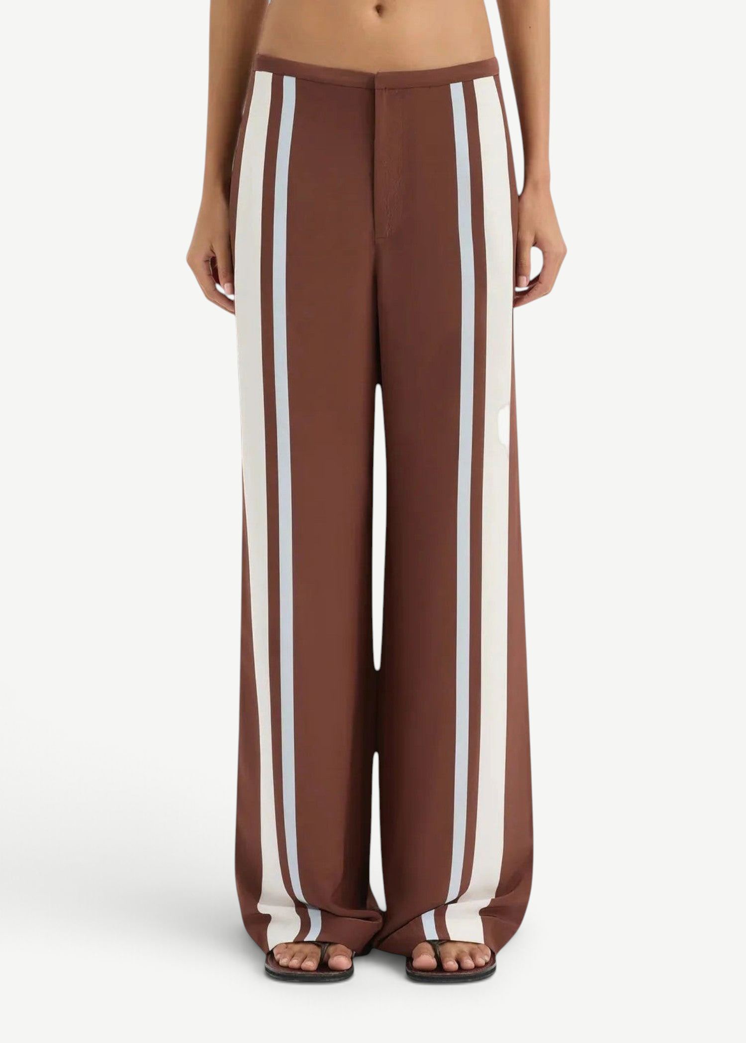 Brown wide-leg pants with white stripes worn by a person on a white background
