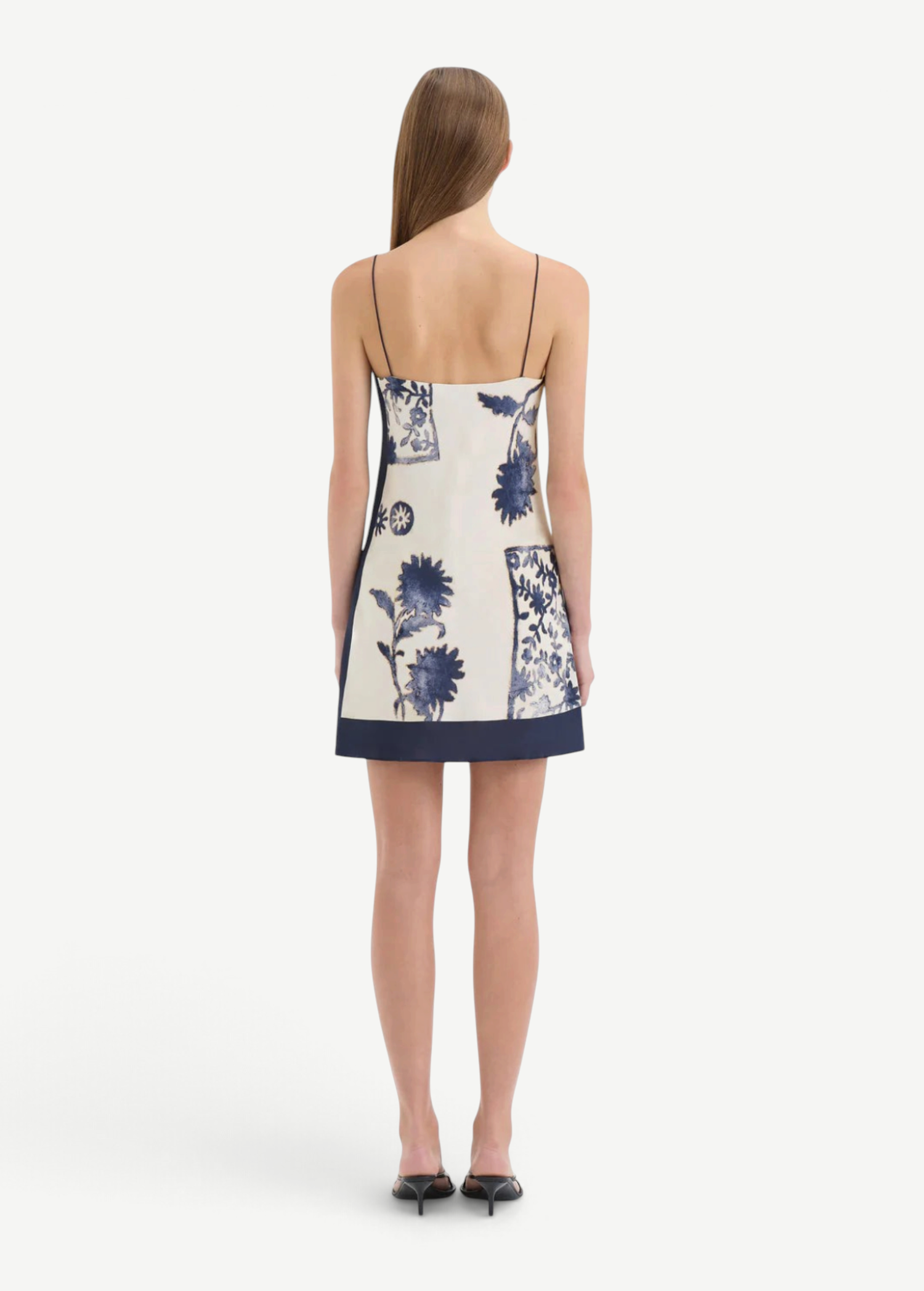 KABE SHOP INC Phillipa slip mini dress in cream and blue floral print with thin straps, back view on a model.