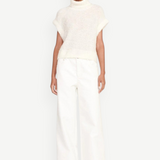 KABE SHOP INC Grayson white wide-leg pants worn by a model with a cream turtleneck sweater