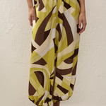 Kortez Balloon Pant featuring a high-waisted, relaxed-fit silhouette with a geometric pattern in olive, brown, and cream.