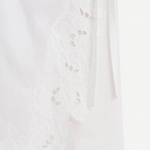 KABE SHOP INC Klara midi skirt in white cotton with delicate floral cut-out embroidery and wrap silhouette detail.