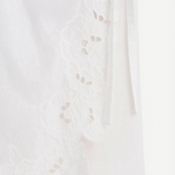 KABE SHOP INC Klara midi skirt in white cotton with delicate floral cut-out embroidery and wrap silhouette detail.