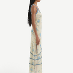 Model wearing KABE SHOP INC Cecile Ruffle Slip Dress in cream with blue floral print and delicate ruffled trim