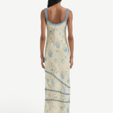 KABE SHOP INC Cecile maxi slip dress in cream with blue floral print, featuring delicate ruffled trim and straps.