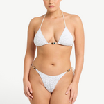 Model wearing KABE SHOP INC white textured bikini with beaded details and adjustable side ties on the Vista Brief