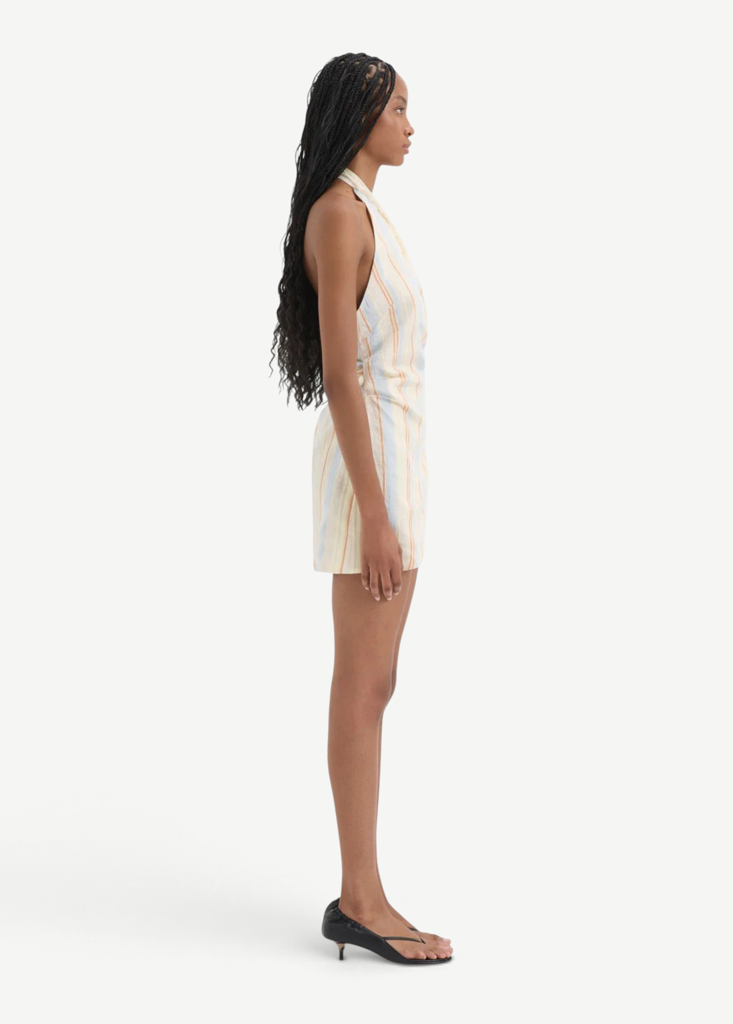 KABE SHOP INC Pernille wrap halter mini dress in striped linen-viscose blend with frayed edges, side profile view.