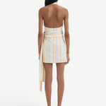 Back view of KABE SHOP INC Pernille wrap halter mini dress in striped linen-viscose with an exaggerated waist tie.