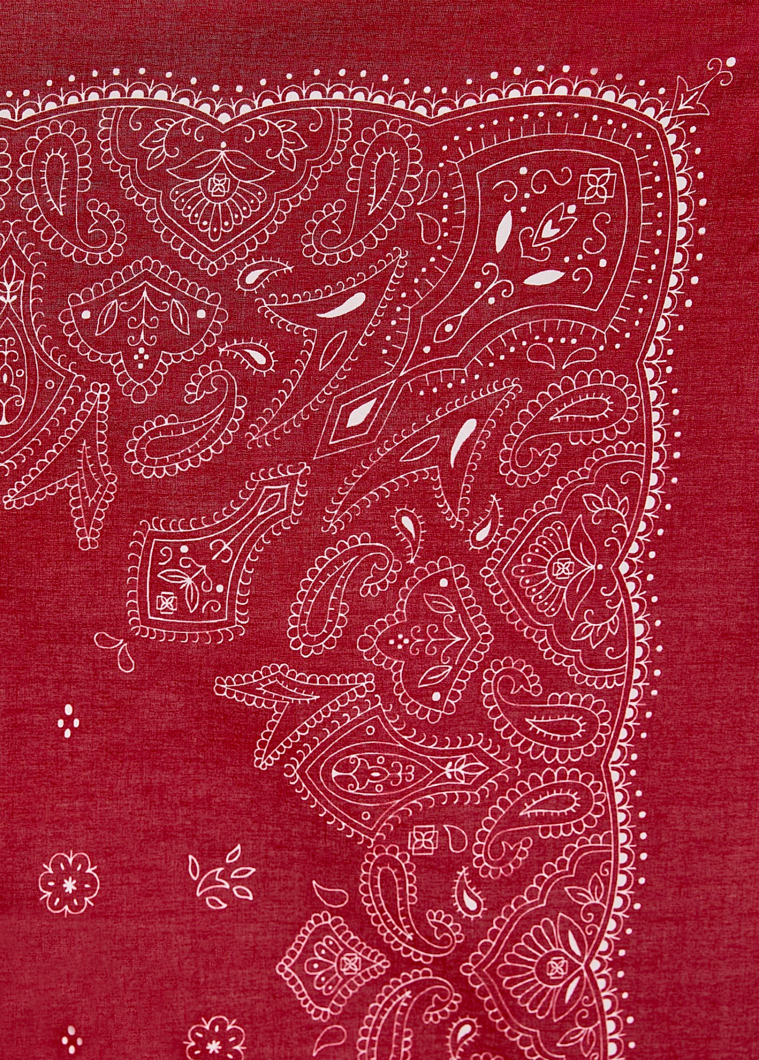 Rosie Top, a cropped shirt in red fabric featuring a white paisley and floral bandana print.