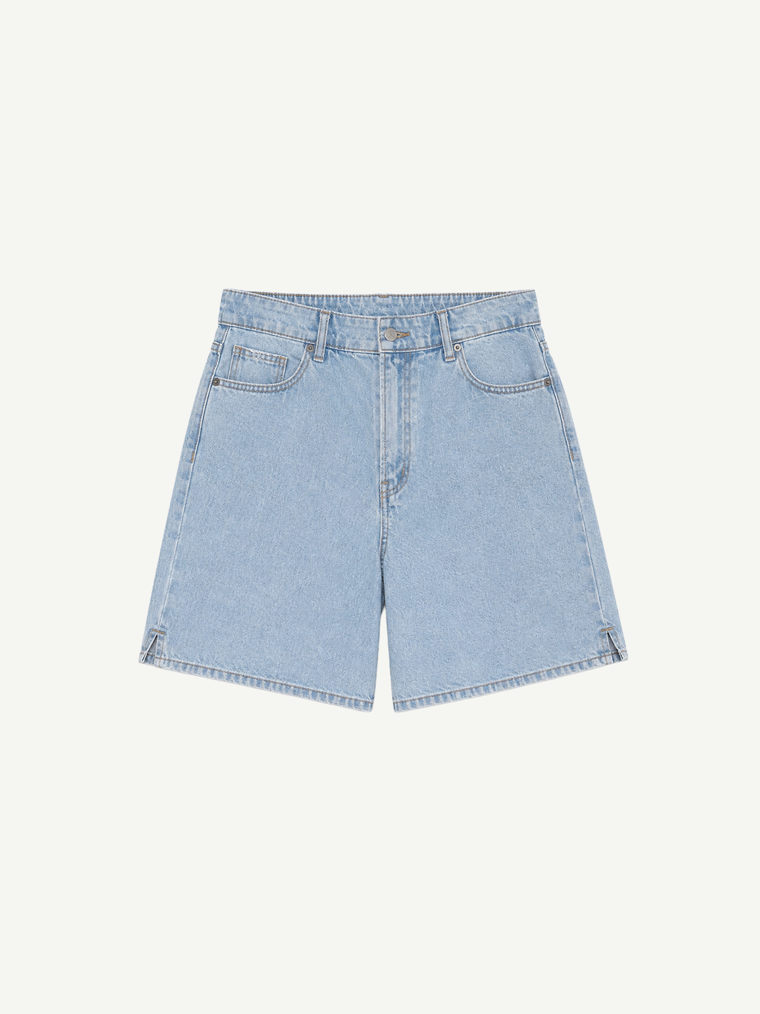 The Lola Shorts are light blue denim high-waisted shorts featuring a classic five-pocket design, belt loops, and a button and zipper closure, displayed on a plain white background.