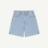 The Lola Shorts are light blue denim high-waisted shorts featuring a classic five-pocket design, belt loops, and a button and zipper closure, displayed on a plain white background.