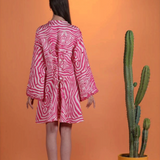 KABE SHOP INC Poccaa classic short kaftan in pink and white zebra print with mirror embellishments and lace-up back