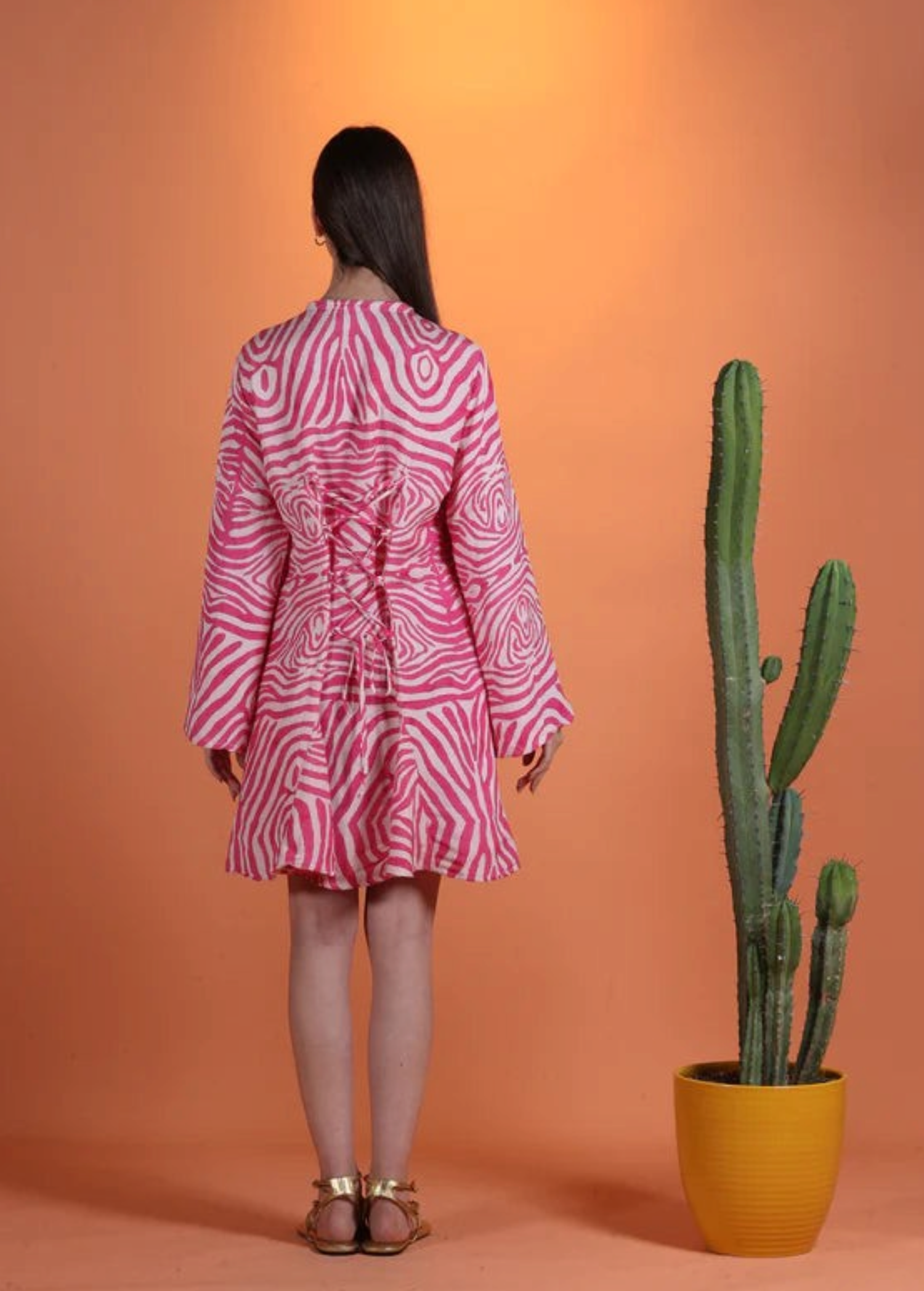 KABE SHOP INC Poccaa short kaftan in pink and white zebra print with back lace-up detail on a model