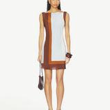 Model wearing KABE SHOP INC Marais mini dress in silk chiffon with brown and light blue color-block design