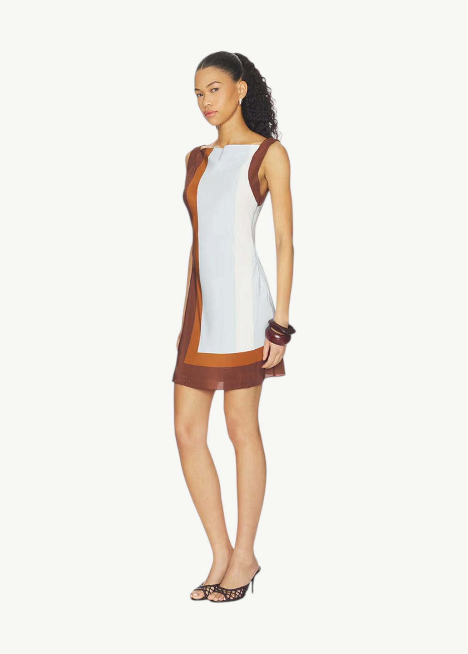 Model wearing KABE SHOP INC Marais mini dress in silk chiffon with brown and white color-block geometric design