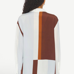 Back view of KABE SHOP INC Marais silk shirt featuring a geometric color-block pattern in white, light blue, and brown.