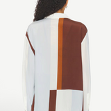 Back view of KABE SHOP INC Marais silk shirt featuring a geometric color-block pattern in white, light blue, and brown.