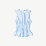 Culver Top in a light blue and white stripe, featuring a sleeveless silhouette with a ruched waist and a feminine peplum hem.