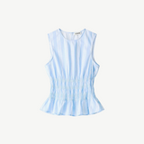 Culver Top in a light blue and white stripe, featuring a sleeveless silhouette with a ruched waist and a feminine peplum hem.