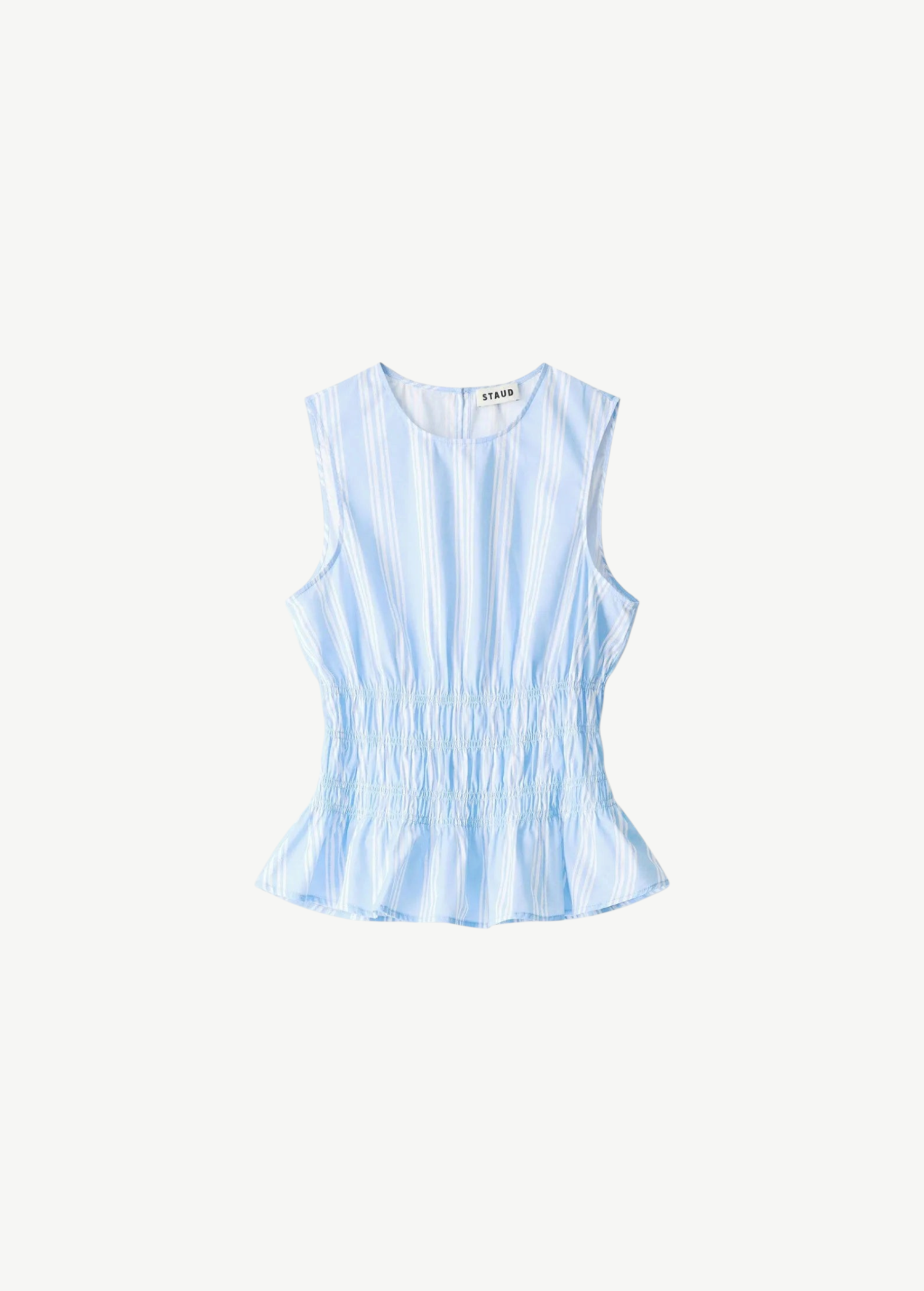Culver Top in a light blue and white stripe, featuring a sleeveless silhouette with a ruched waist and a feminine peplum hem.