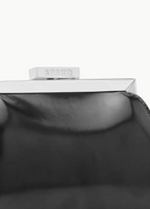 KABE SHOP INC Lennon convertible bag in black leather with a polished silver metal frame and branded clasp detail