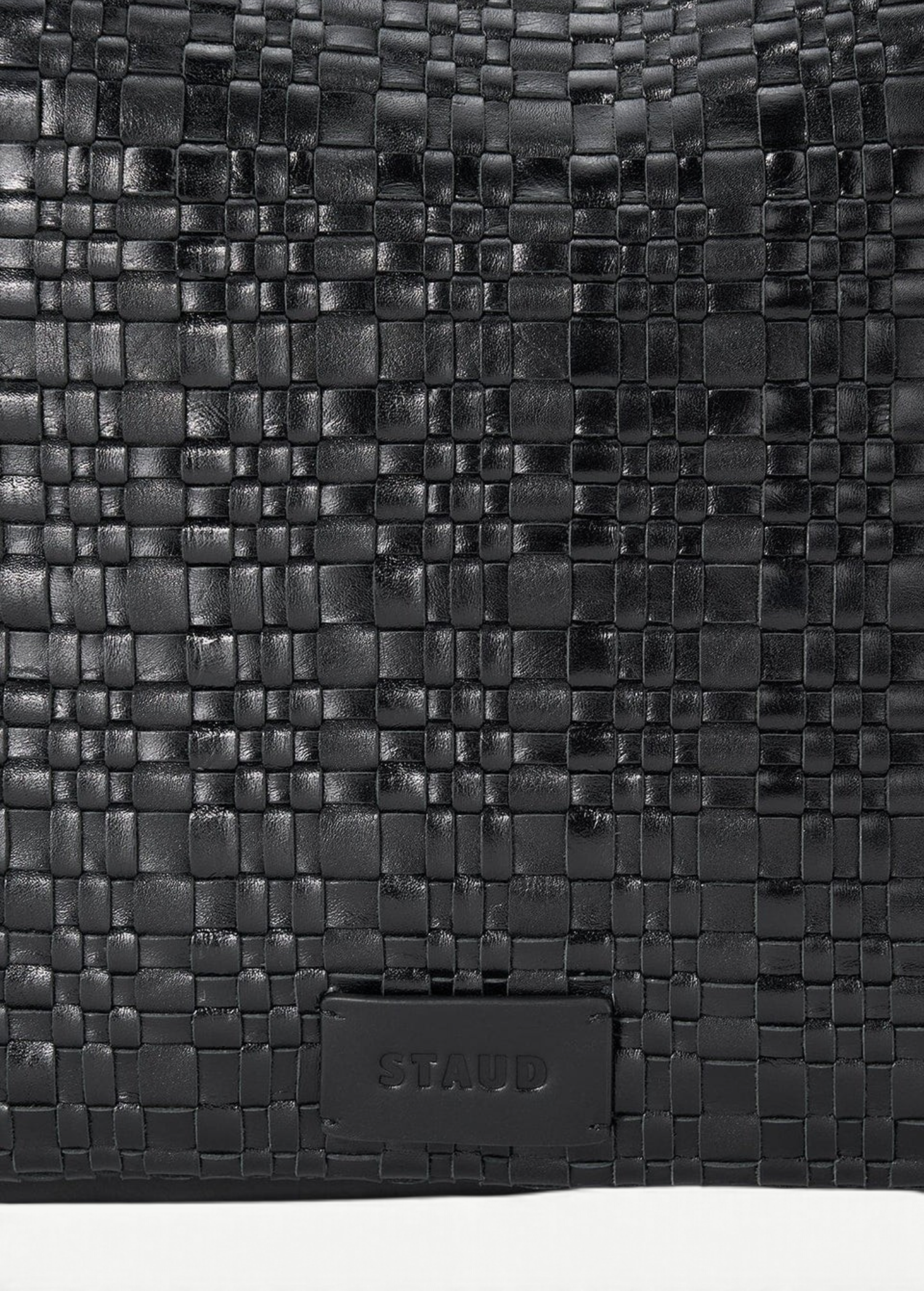 KABE SHOP INC Maya hobo bag featuring a black woven leather texture with a subtle embossed brand logo patch.