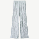 Light blue Nami Pant wide-leg trousers featuring a vertical crinkled texture and an elastic waistband for a relaxed silhouette.