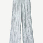 Light blue Nami Pant wide-leg trousers featuring a vertical crinkled texture and an elastic waistband for a relaxed silhouette.