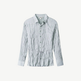 Light blue long-sleeved Suki Shirt with a crinkled texture and a thin drawstring waist tie.
