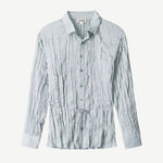 Light blue long-sleeved Suki Shirt with a crinkled texture and a thin drawstring waist tie.