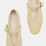 A pair of Stella Slipper Leather Shoes in beige custard leather, featuring a rounded toe, a single strap with an elegant buckle across each shoe, and minimal stitching detail, displayed against a white background.