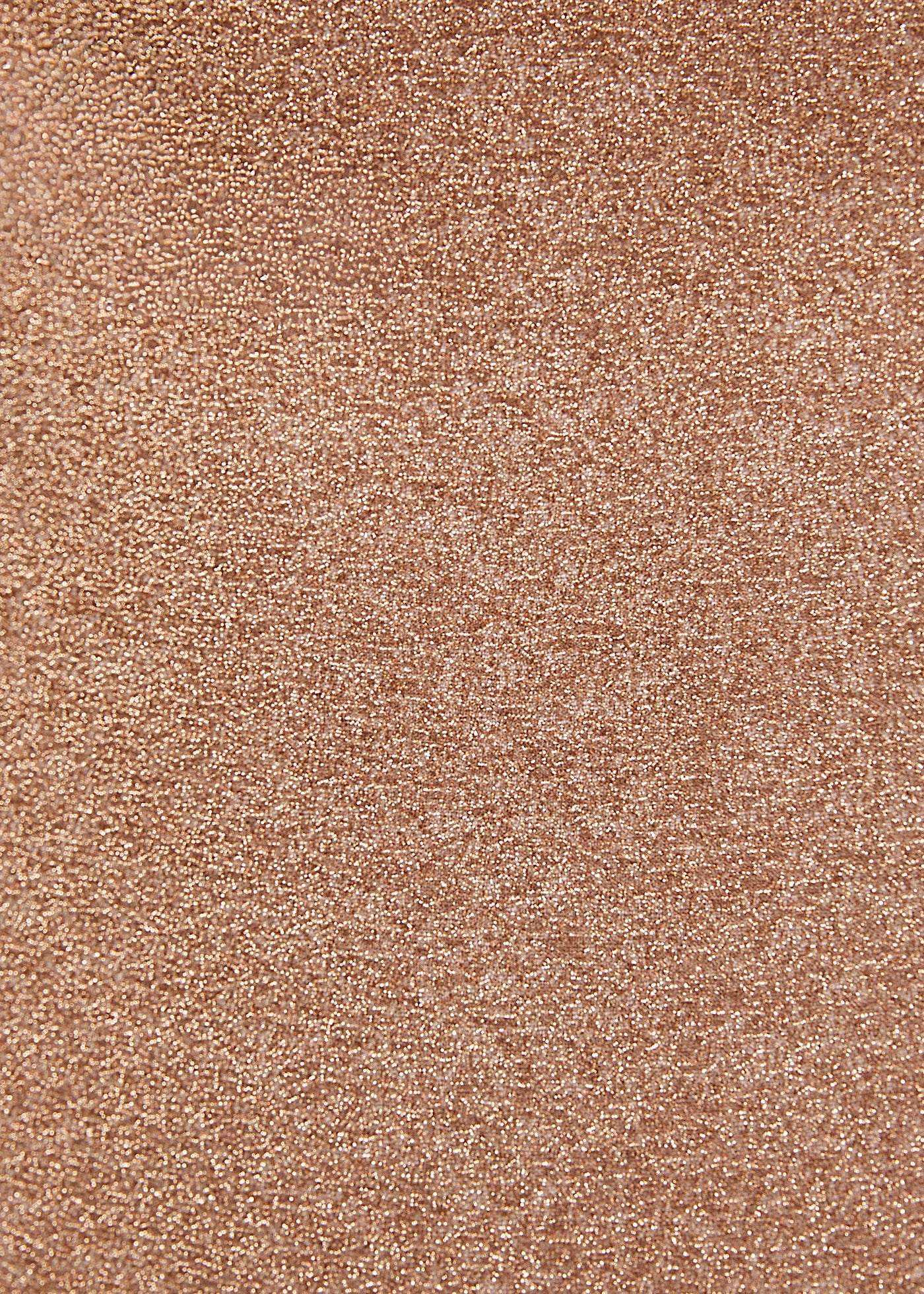 Close-up of a glittery, textured rose gold surface with a shimmering effect reminiscent of the Gwen Skirt. The image showcases fine, reflective particles that create a sparkling appearance.