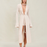 Model wearing KABE SHOP INC Sienna maxi knit robe in cream with ruffle neckline and beaded front tie closure