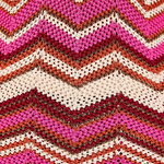 KABE SHOP INC Cierra Pant featuring a vibrant pink, cream, and metallic bronze chevron knit pattern