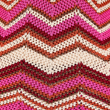 KABE SHOP INC Cierra Pant featuring a vibrant pink, cream, and metallic bronze chevron knit pattern