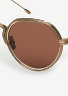 KABE SHOP INC Annie-O round sunglasses in rose gold with acetate-wrapped titanium frames and step-cut temples.