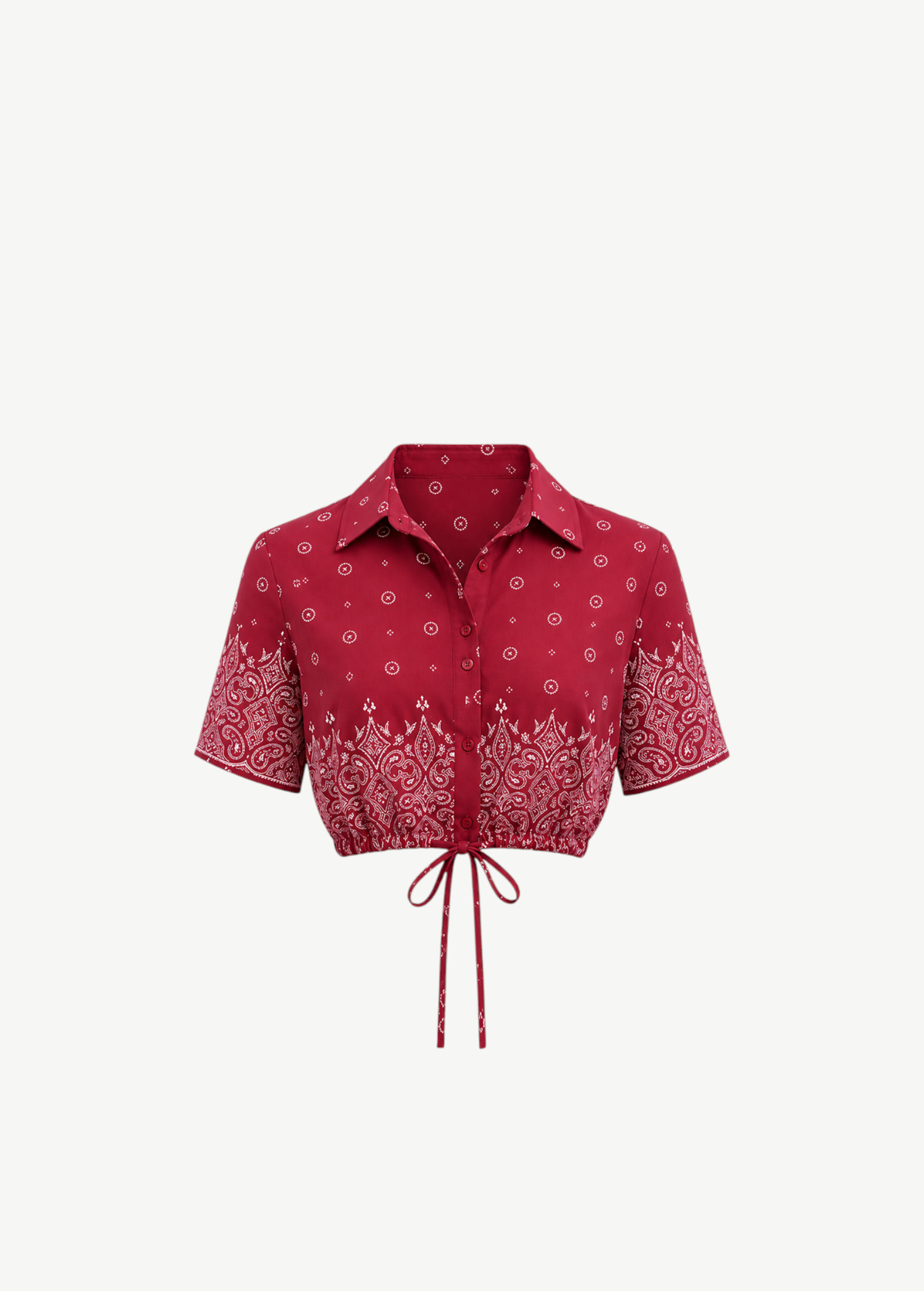 Rosie Top, a red short-sleeved collared cropped shirt with a white paisley print and an adjustable drawstring waist tie.