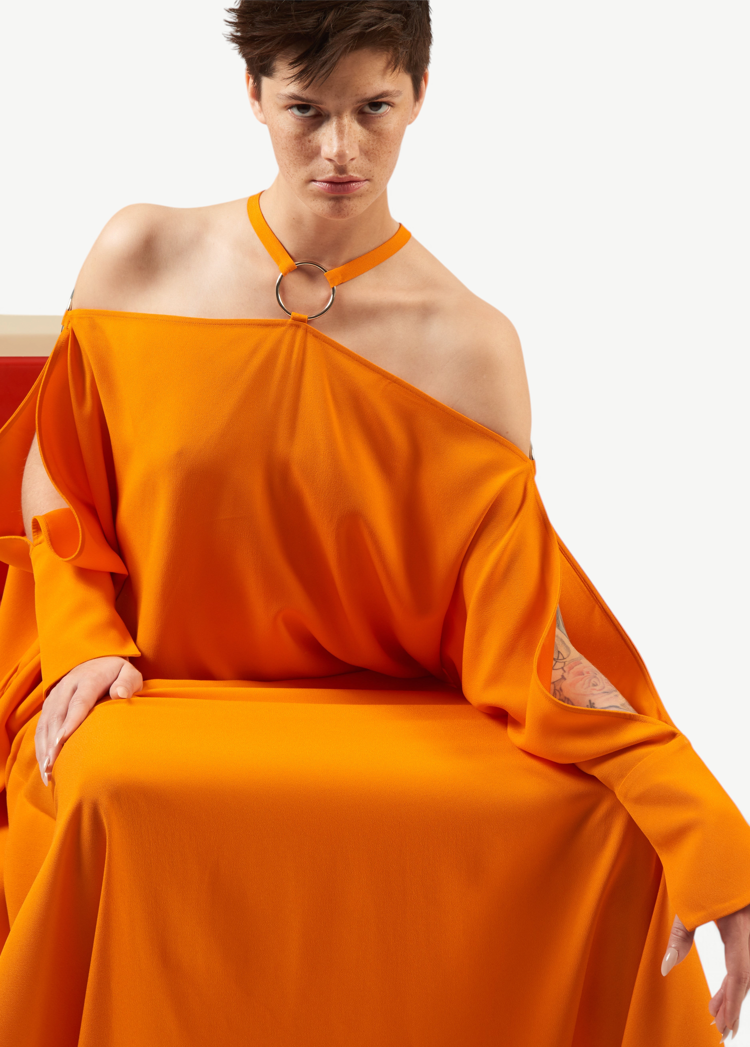 KABE SHOP INC Volturno kaftan in vibrant orange with off-shoulder halterneck and silver ring embellishment
