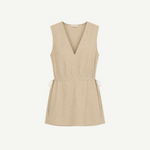 Selan Top in a beige sleeveless V-neck silhouette with a drawstring waist and a refined diagonal pinstripe pattern.