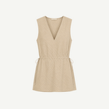 Selan Top in a beige sleeveless V-neck silhouette with a drawstring waist and a refined diagonal pinstripe pattern.