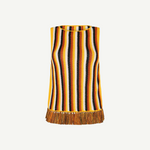 Misti Sleeveless Top featuring a sleek silhouette with vertical yellow, brown, white, and black stripes and an artisanal fringed hem.
