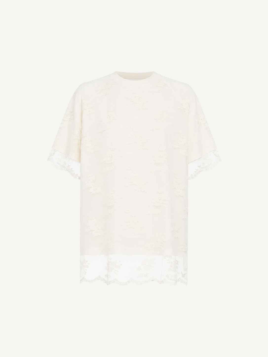 Relaxed Fit T-Shirt with Lace Overlayer featuring short sleeves, an ivory lace overlay, a round neckline, and scalloped lace trim at the hem and sleeves, displayed against a white background.