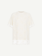 Relaxed Fit T-Shirt with Lace Overlayer featuring short sleeves, an ivory lace overlay, a round neckline, and scalloped lace trim at the hem and sleeves, displayed against a white background.