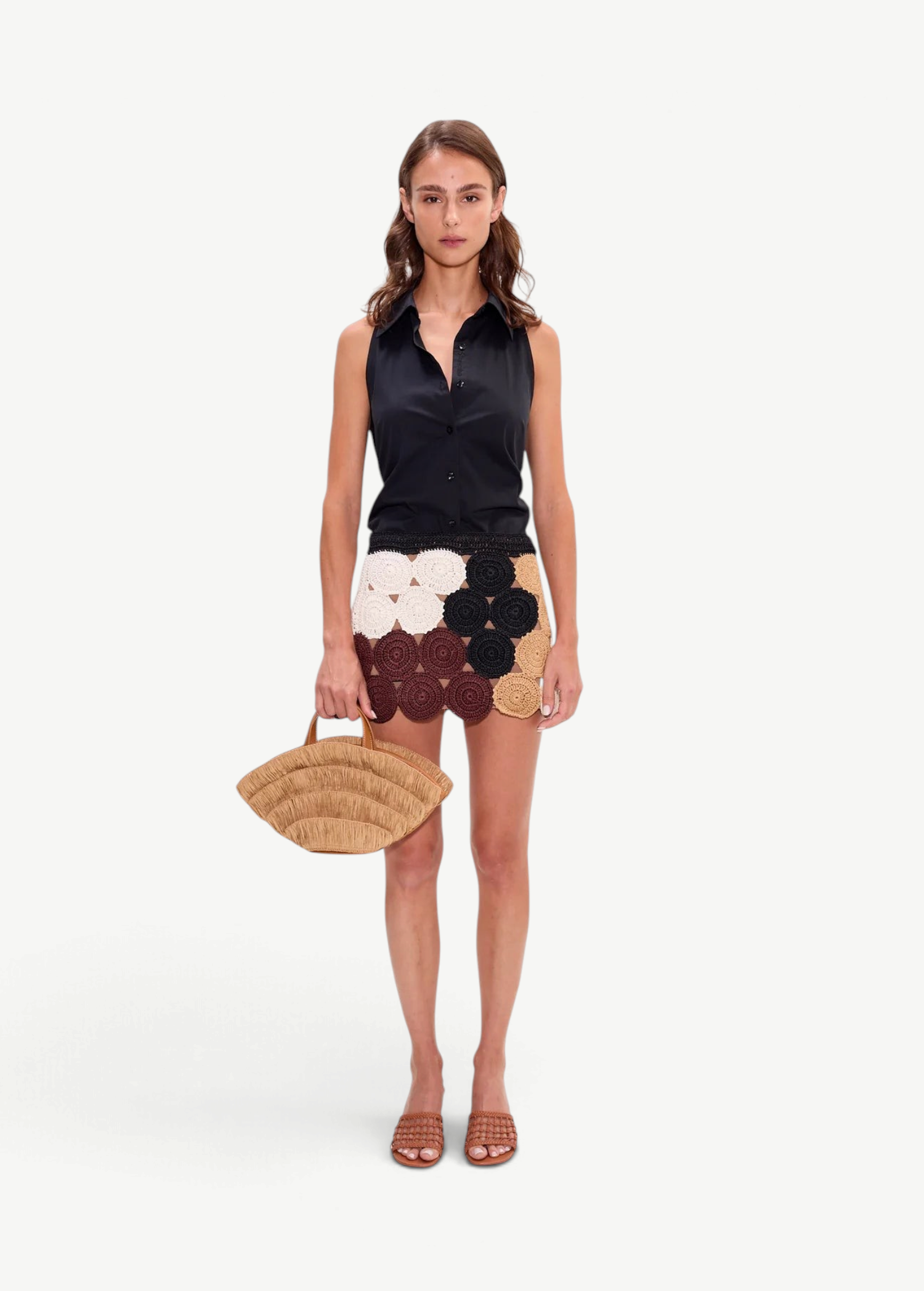 Model wearing KABE SHOP INC Beep Beep mini skirt featuring earth-tone crochet circular motifs and a neutral lining.