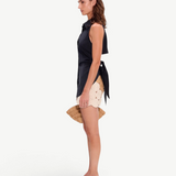 KABE SHOP INC Beep Beep mini skirt in earth-tone crochet with circular motifs, worn with a black sleeveless top.